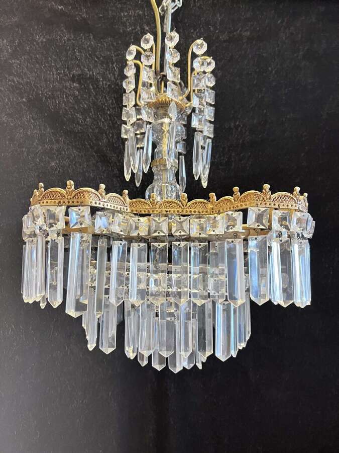 A Five Light Italian Brass and Crystal Antique Chandelier in a Deco Style