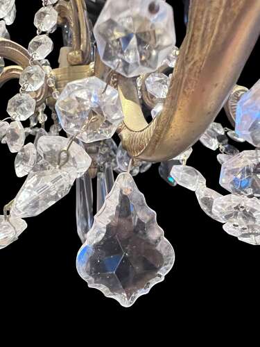 A  Pair of Six Light French Brass and Crystal Antique Chandeliers
