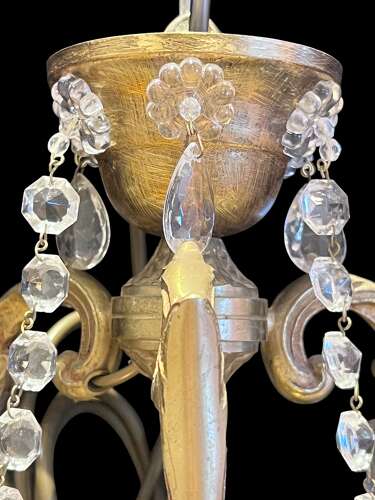 A  Pair of Six Light French Brass and Crystal Antique Chandeliers