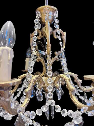 A  Pair of Six Light French Brass and Crystal Antique Chandeliers